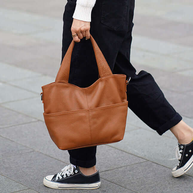 Spacious interior of a leather tote handbag ideal for carrying personal items, notebooks, and more.