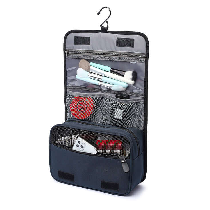 Open hanging toiletry bag showing makeup and brush compartments