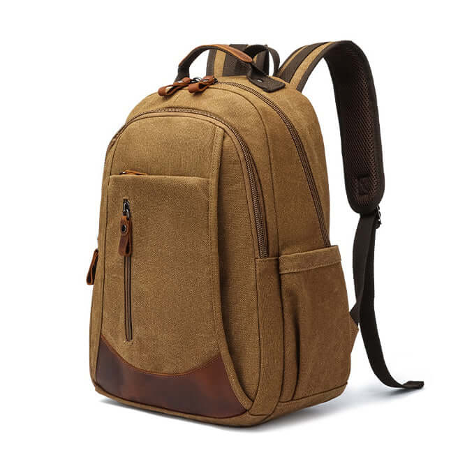 Side profile of coffee canvas backpack showing deep utility pocket