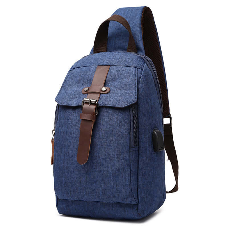 Front view of a blue waterproof sling bag with multiple compartments.