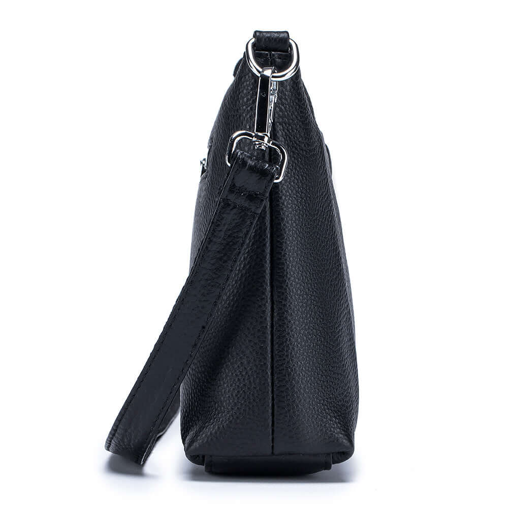 Side view of women's black leather crossbody bag highlighting sleek and elegant style.