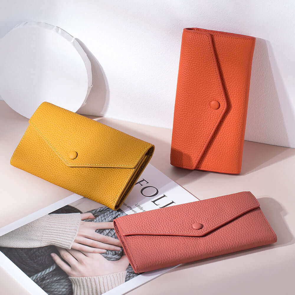 Women's Leather Bifold Envelope Wallet in various color options, showcasing the collection.