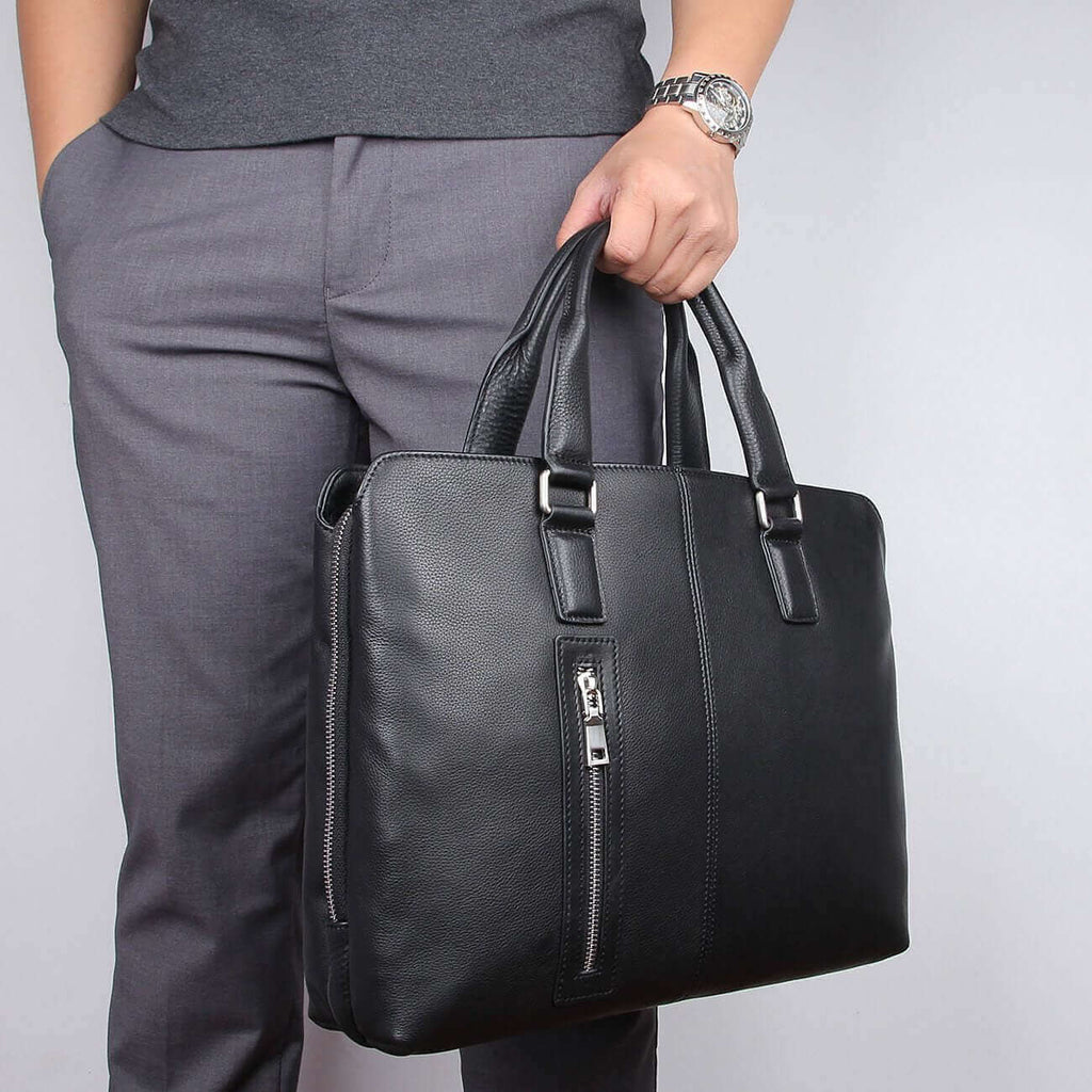 Compact dimensions of the black leather laptop bag suitable for 14-inch laptops.