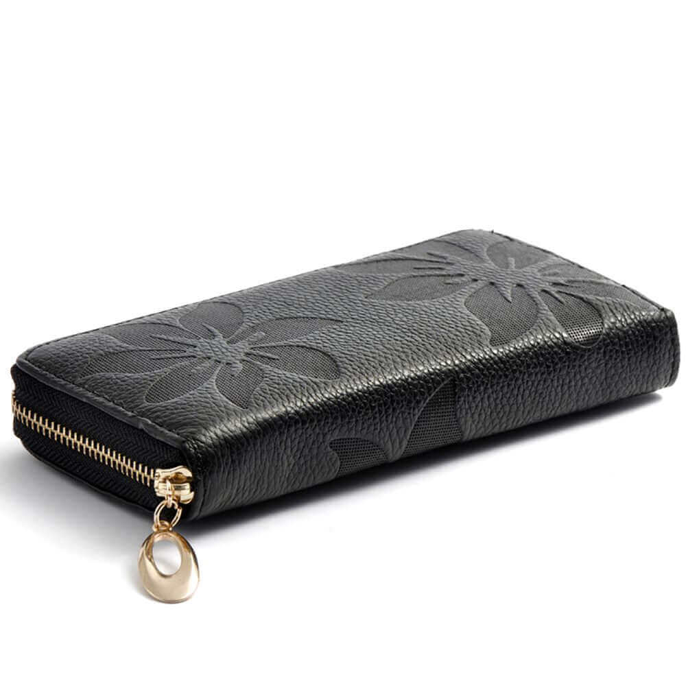 Black embossed leather wallet featuring gold hardware.