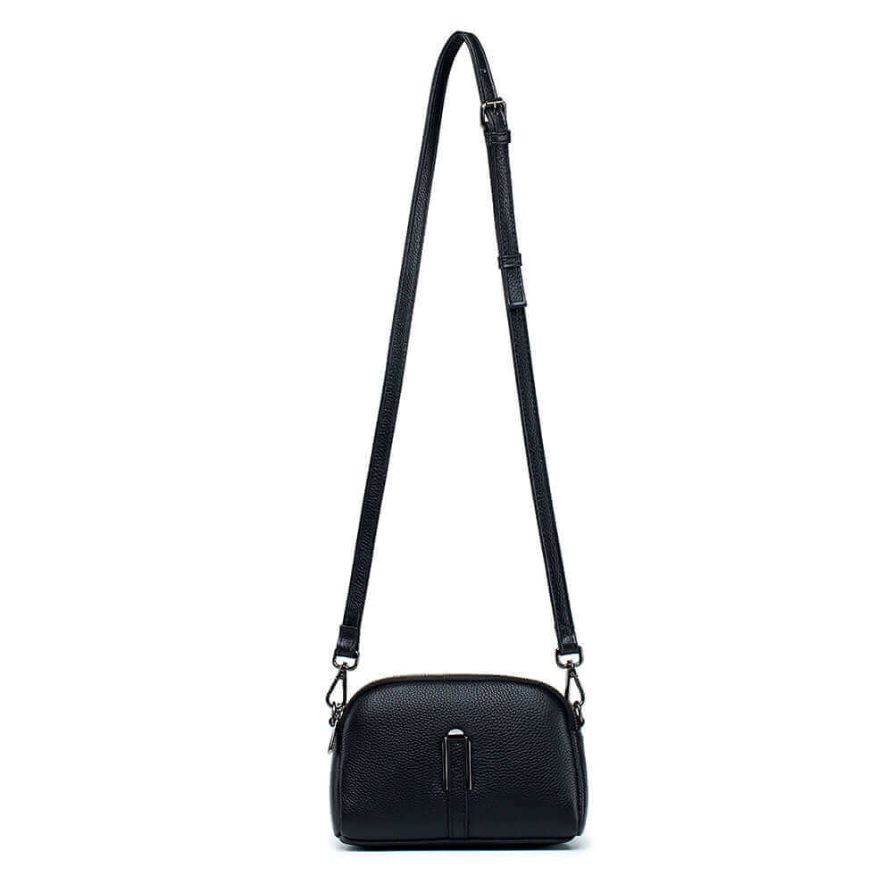 Leather crossbody bag for women, featuring a double zipper for easy access to two compartments.