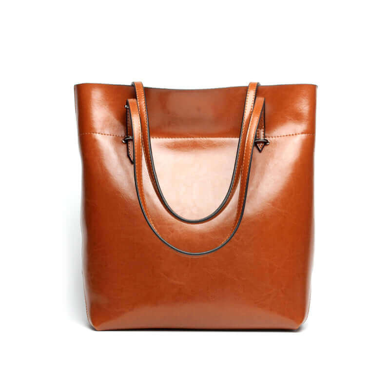 Front view of the leather shoulder tote bag in tan color.