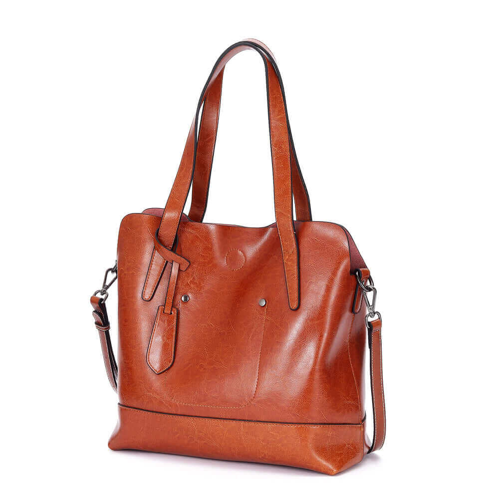 Front view of a leather crossbody tote bag with magnetic closure.