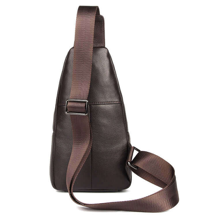 Back view of a men's leather chest bag with an adjustable strap.