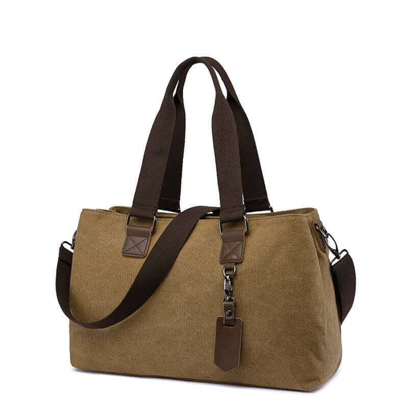 Multi-compartment canvas tote bag for women with three zippered sections.