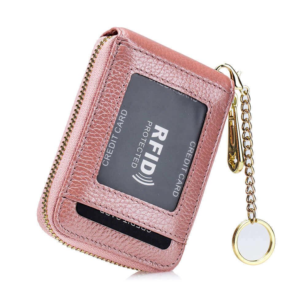 Pink leather card holder wallet with key ring and 12 card slots.

