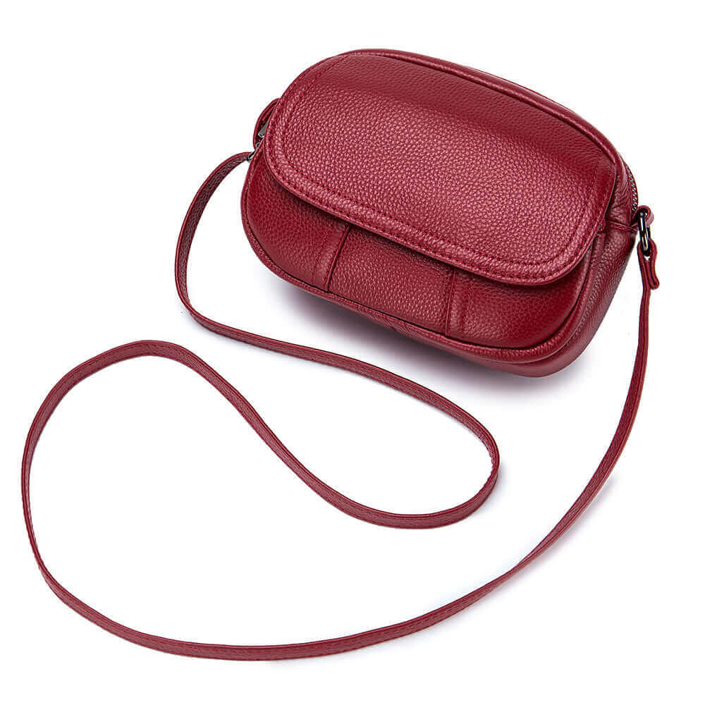 Small leather round bag for women, perfect for daily wear and travel with its compact size and ample storage.