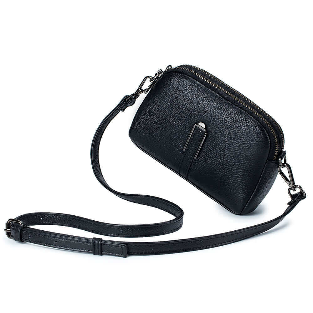 Stylish black leather crossbody bag for women, featuring double zippers and multiple compartments.