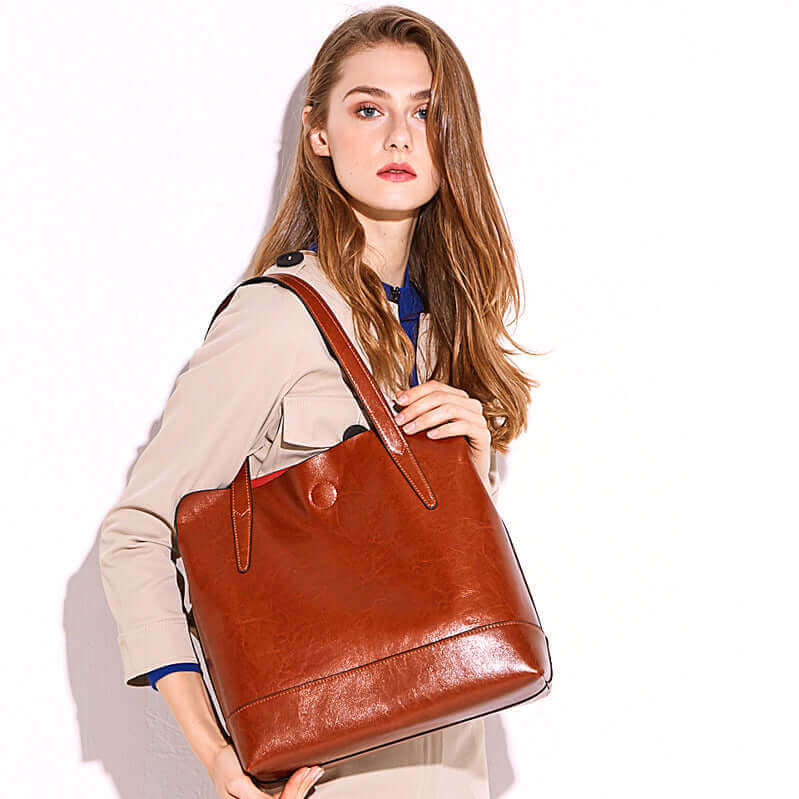 Versatile tote handbag with magnetic closure and multiple compartments.