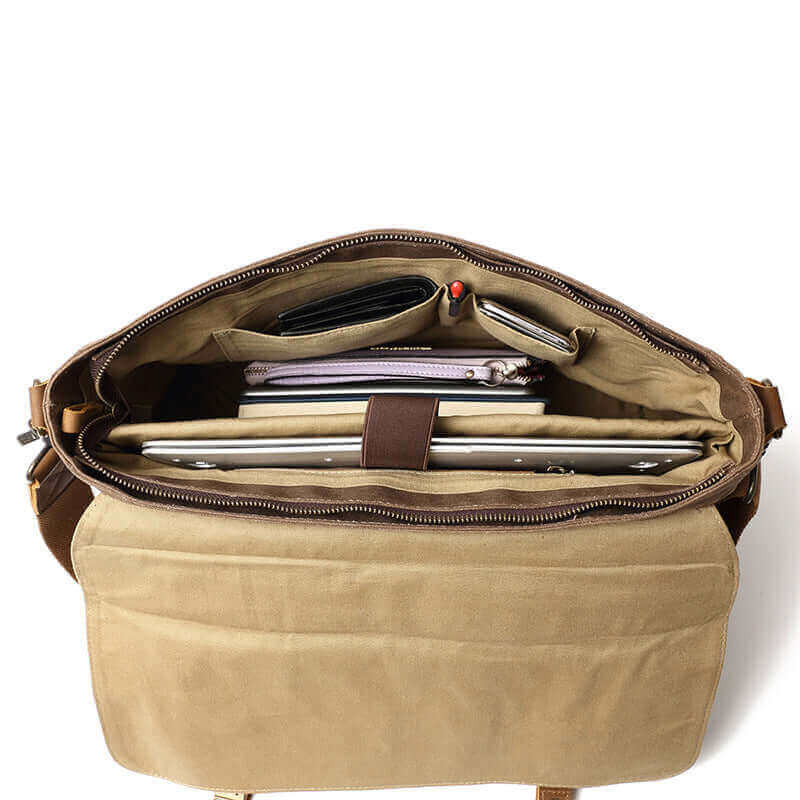 View of the laptop compartment inside the vintage messenger bag, designed to fit most laptops.