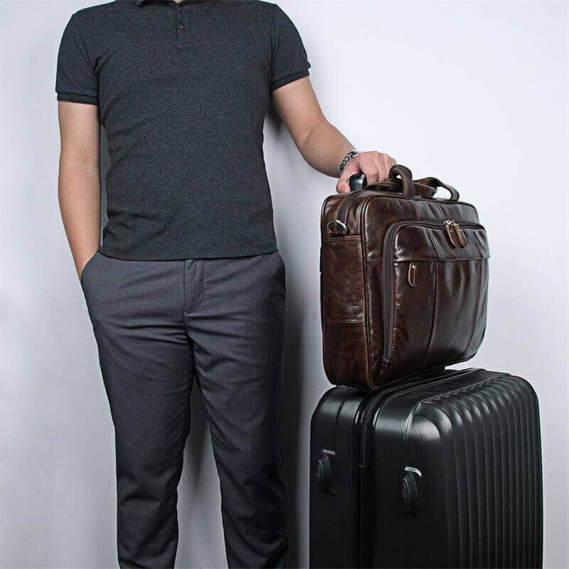 Vintage brown leather laptop bag for business style.