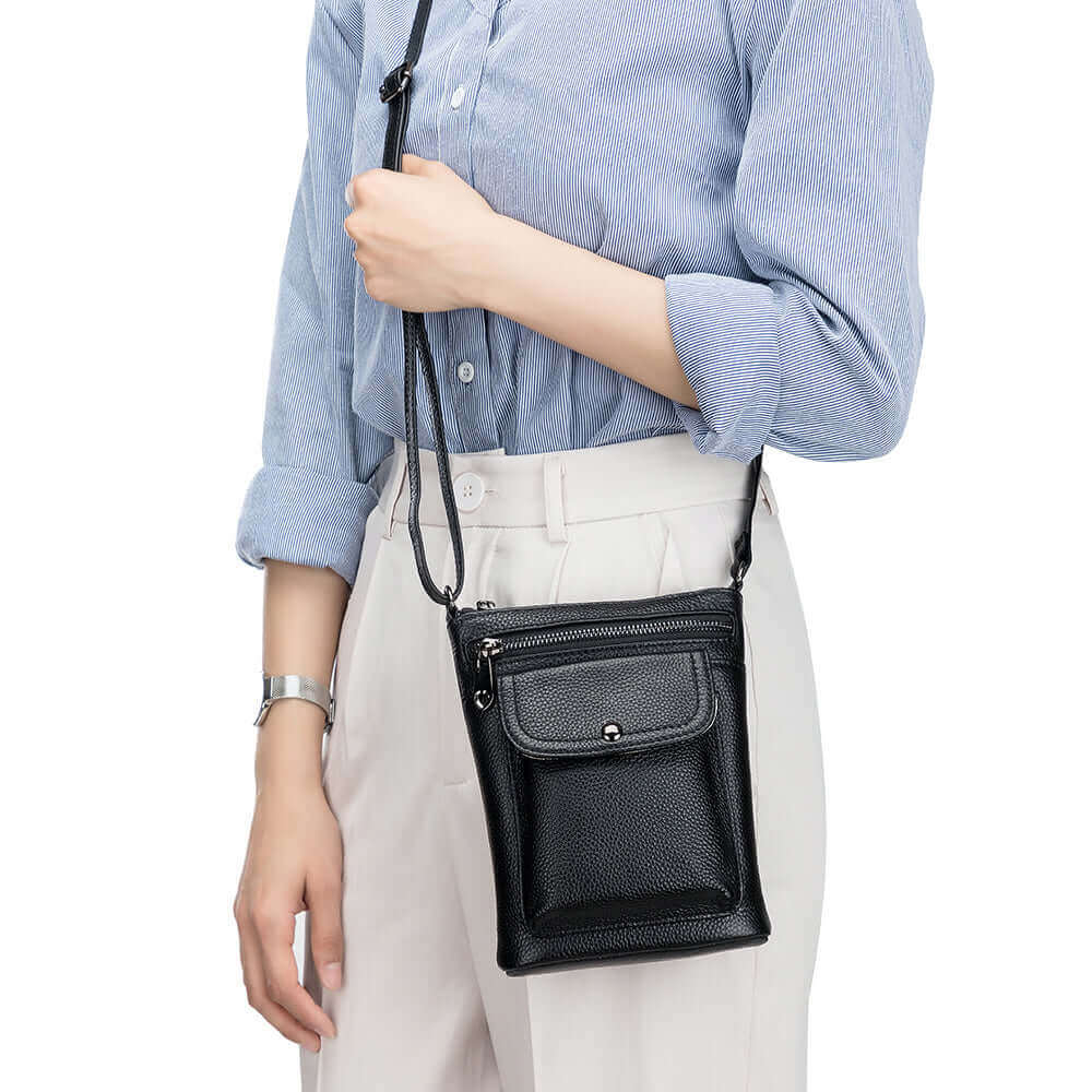 Women's crossbody bag with a front pocket for quick access to small items.