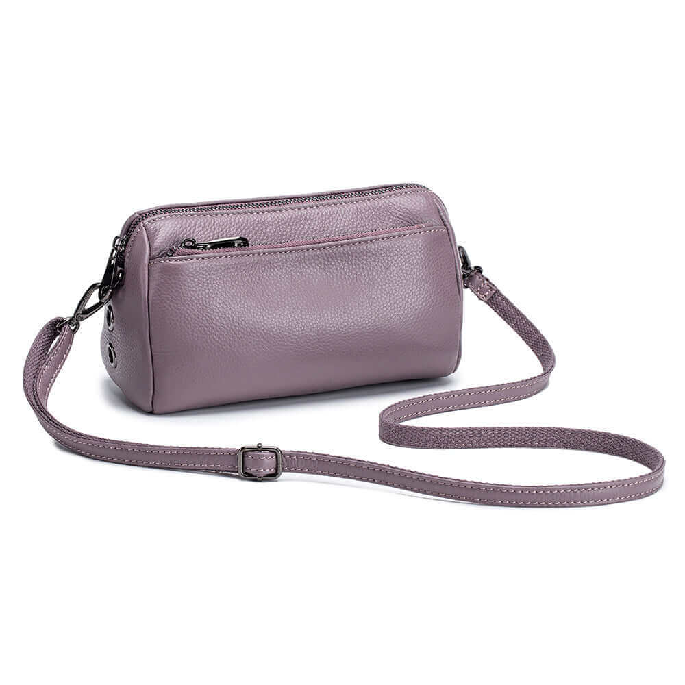 Women's European and American minimalist style leather crossbody bag with functional pockets.