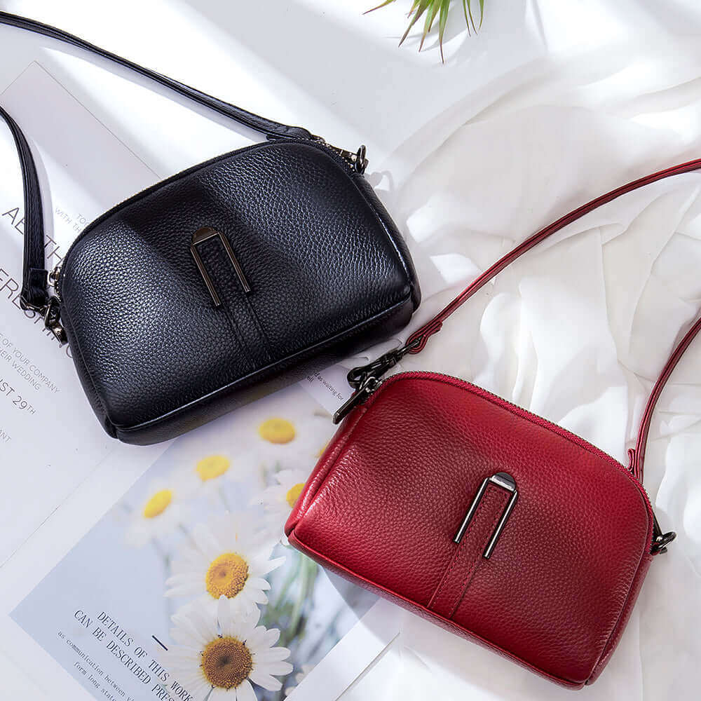 Women's genuine leather crossbody bag with two main bags, card slot, and outer zipper pocket.