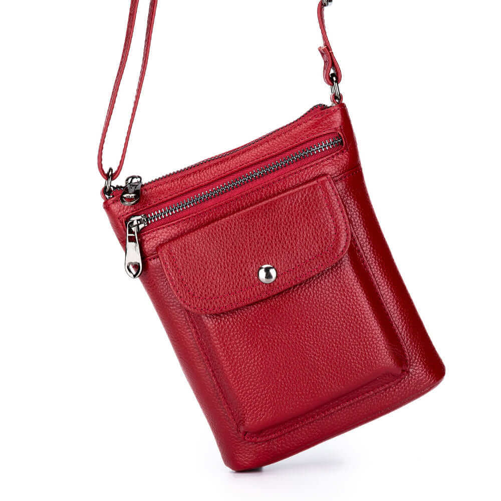 Women's mini crossbody bag with zipper pocket, crafted from genuine leather.